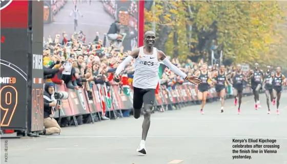  ??  ?? Kenya’s Eliud Kipchoge celebrates after crossing the finish line in Vienna yesterday.