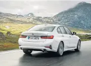  ??  ?? Whether coming or going, the new 3 Series leaves an impression. Similariti­es in styling to the X5 and X7 are found in the roomier and quieter cabin, left.