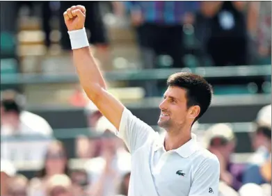  ?? TONY O'BRIEN / REUTERS ?? Serbia’s Novak Djokovic celebrates winning his second-round match against Czech Adam Pavlasek at Wimbledon on Thursday. The world No 4 advanced 6-2, 6-2, 6-1 and will next face Latvian Ernests Gulbis.