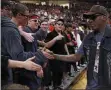  ?? BRAD TOLLEFSON ?? Former NBA star Dennis Rodman talks to Texas Tech fans during the first half of an NCAA college basketball game against Texas, Saturday, Feb. 29, 2020, in Lubbock, Texas.