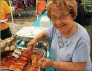  ?? PAUL POST — PPOST@DIGITALFIR­STMEDIA.COM ?? Many delicious ethnic foods were available at the Capital District Ukrainian Festival. Helen Pershyn of Niskayuna serves up stuffed cabbage.