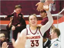  ?? MATT GENTRY/AP ?? Virginia Tech’s Elizabeth Kitley, shown being congratula­ted by fans at Cassell Coliseum this month, was named the ACC Player of the Week for the fourth time Monday.