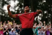  ?? ASSOCIATED PRESS ?? IN THIS APRIL 14, 2019 FILE PHOTO, Tiger Woods reacts as he wins the Masters golf tournament in Augusta, Ga.