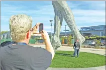  ?? AP image ?? City officials and the sculptor of the steel nude, which was unveiled this week across from San Leandro’s main commuter train stop, say they want to draw attention to “feminine energy.”