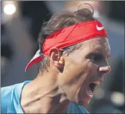 ?? MICHEL EULER — THE ASSOCIATED PRESS ?? Spain’s Rafael Nadal screams after scoring a point against Argentina’s Diego Schwartzma­n in the semifinal match of the French Open at the Roland Garros stadium in Paris, France, on Friday.