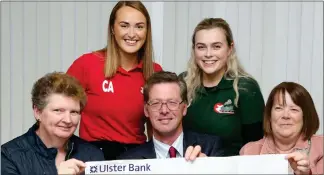  ?? ?? Clogher Young Farmers (back) Claire Allen and Lauren Smyth, presenting a cheque (out of shot) for £650, proceeds of their fundraisin­g events at Clogher Valley Show, to Cancer Focus NI representa­tives Lynn Winslow and Fiona Wilson. Included is Nicholas Lowry, Show Chairman.