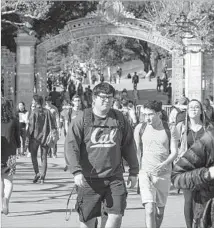  ??  ?? UC BERKELEY students are now accustomed to the disruption­s caused by high-profile speakers. They just try to carry on.