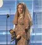  ?? ROBERT HANASHIRO/USA TODAY NETWORK ?? Beyoncé accepts Best Urban Contempora­ry Album during the 59th Annual Grammy Awards in 2017.