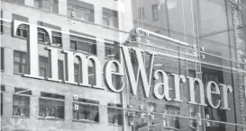  ?? ANDREW BURTON/GETTY IMAGES ?? AT&T reportedly has reached a deal to acquire Time Warner for more than $85.4 billion.