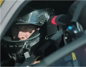  ?? CITIZEN NEWS SERVICE PHOTO BY GRAHAM HUGHES ?? Actor Michael Fassbender speaks to his driving coach as he prepares for the Ferarri Challenge practice at the Canadian Grand Prix F1 race last week in Montreal.