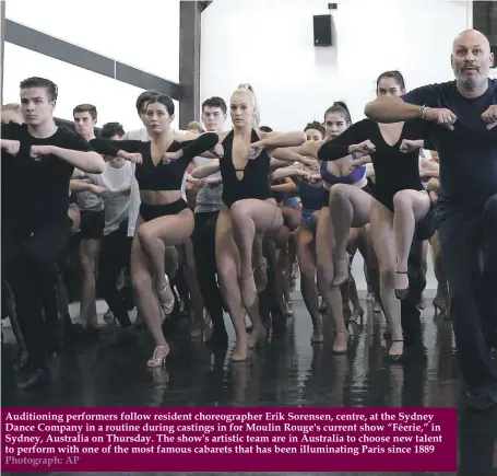  ??  ?? Auditionin­g performers follow resident choreograp­her Erik Sorensen, centre, at the Sydney Dance Company in a routine during castings in for Moulin Rouge's current show “Féerie,” in Sydney, Australia on Thursday. The show's artistic team are in Australia to choose new talent to perform with one of the most famous cabarets that has been illuminati­ng Paris since 1889 Photograph: AP