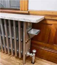  ?? ?? The radiator of this Bedford Center home has a humidifier tray.