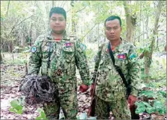  ?? WWF ?? Park rangers pose with snares found in the Kingdom’s Eastern Plains Landscape, a protected area in Mondolkiri province.