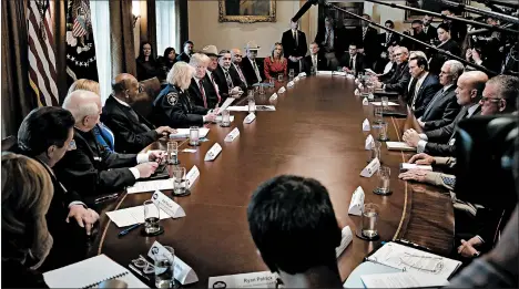  ?? JACQUELYN MARTIN/AP ?? President Donald Trump, center left, leads a roundtable discussion Friday on border security with local leaders.