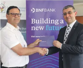  ??  ?? George Debono, Chief Commercial Officer at BNF Bank with Martin Xuereb, Chairperso­n of RMHC Malta