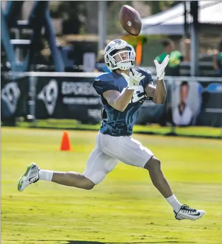  ?? Allen J. Schaben Los Angeles Times ?? BRANDIN COOKS, hauling in a pass during training camp, had more than 1,000 yards receiving the last three seasons, catching balls from Drew Brees and Tom Brady. The Rams were so impressed, they traded for him and gave him a five-year extension.