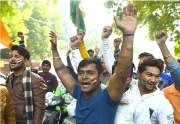  ?? — AFP photo ?? Indian demonstrat­ors shout slogans against Pakistan during a protest in New Delhi, after an attack on a paramilita­ry Central Reserve Police Force (CRPF) convoy in the Lethpora area of Kashmir.