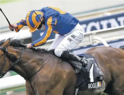  ??  ?? Mogul, ridden by Ryan Moore, wins the Hong Kong Vase.