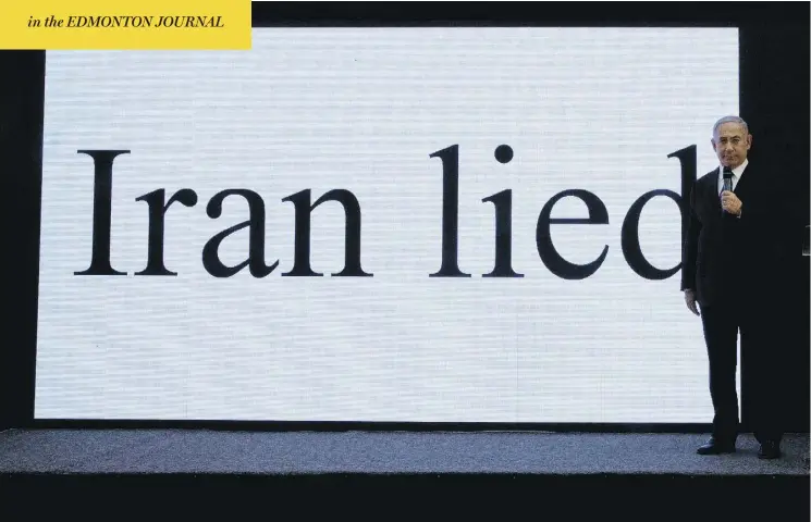  ?? SEBASTIAN SCHEINER / THE ASSOCIATED PRESS ?? Israeli leader Benjamin Netanyahu presents material on Iranian nuclear weapons developmen­t Monday, in a bid to influence an upcoming U.S. decision on the nuclear deal.