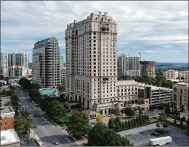  ?? HYOSUB SHIN / HSHIN@AJC.COM ?? Christophe­r and Connie Brogdon own a $5 million residence near the top of the St. Regis, one of Buckhead’s most elite addresses. The couple’s costs include $22,000 in monthly mortgage payments and other costs for the home.