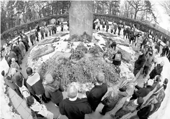  ??  ?? In this file photo communists and socialists lay down flowers at the Monument for the Socialists at Berlin’s Friedrichs­felde Central Cemetery to commemorat­e the murder of Rosa Luxemburg and Karl Liebknecht. A morose and deeply divided left party commemorat­es in Berlin Rosa Luxemburg, a mythical revolution­ary figure murdered 100 years ago. — AFP photo