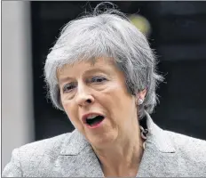  ?? AP PHOTO ?? Britain’s Prime Minister Theresa May makes a statement outside 10 Downing Street, London, Thursday.