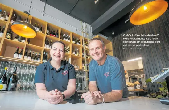  ?? Photo / Paul Taylor ?? Chef Carlita Campbell and Cellar 495 owner Michael Henley at the newlyopene­d wine bar, bistro, tasting room and wine shop in Hastings.