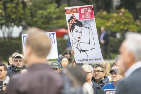  ?? Peter DaSilva / Special to The Chronicle ?? Demonstrat­ors rally outside the state Capitol in Sacramento last month in an effort to repeal AB5, the new gig work law.