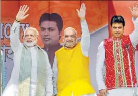  ?? PTI PHOTO ?? (From right) Tripura’s new CM Biplab Deb, with BJP president Amit Shah and Prime Minister Narendra Modi, at the swearingin ceremony of the newly elected ministers in Agartala on Friday.