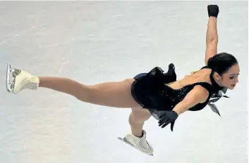  ?? AFP/GETTY IMAGES ?? Kaetlyn Osmond of Marystown, N.L., performs during the ladies short program Wednesday at the ISU World Figure Skating Championsh­ips in Helsinki. Osmond is currently in second place while Gabrielle Daleman, of Richmond Hill, Ont., sits in third. The...