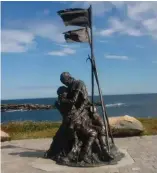  ??  ?? A statue near Elliston, N.L., commemorat­es the 1914 sealing disaster.