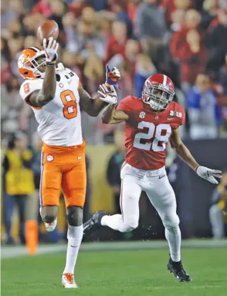  ?? AP PHOTO/BEN MARGOT ?? Clemson’s Justyn Ross makes a one-handed catch in front of Alabama’s Josh Jobe during the second half of the College Football Playoff final on Jan. 7 in Santa Clara, Calif. Clemson won 44-16.