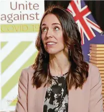  ?? Associated Press ?? New Zealand Prime Minister Jacinda Ardern reacts to the trembles of an earthquake on Monday during a live TV interview.