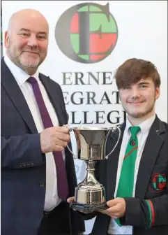  ?? ?? Receiving the Principal’s Award from Mr. Jackson-ware is Liam Maguire.