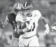  ?? AP/al.com/MIKE KITTRELL ?? Georgia Southern running back Wesley Fields breaks into the open field during Wednesday night’s GoDaddy Bowl in Mobile, Ala. Fields rushed for 75 yards and a touchdown on nine carries.