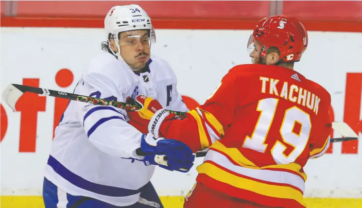  ?? AL CHAREST / POSTMEDIA NEWS FILES ?? Auston Matthews, seen battling with Matthew Tkachuk of the Flames, leads a high-scoring Maple Leafs team that gives up the fewest goals per game in the North Division.