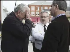  ?? AP PHOTO/PHIL SKINNER/ATLANTA JOURNAL-CONSTITUTI­ON ?? Locust Grove Mayor Robert Price (left) reacts to one of his officers being killed as he talks to Henry Chief Deputy David Foster (center) and Sheriff Keith McBrayer, after a press conference at a Henry County Fire station on Friday in Locust Grove, Ga....