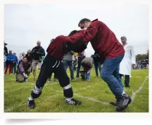  ?? ?? Held at the end of Whit Week, the Cotswold Olimpick Games feature the bruising Shin-kicking World Championsh­ips