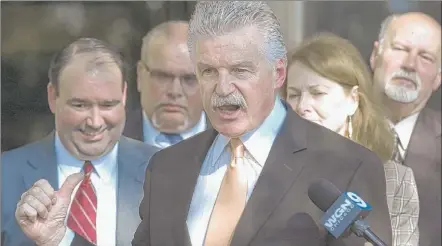  ?? | MATTHEW GROTTO~SUN-TIMES MEDIA ?? Will County State’s Attorney James Glasgow (center) addresses the media after the verdict.