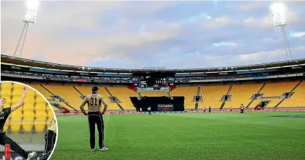  ?? GETTY IMAGES ?? New Zealand’s Martin Guptill fields at a deserted Sky Stadium on Wednesday. Inset, Riley Meredith, of Australia, made a big impact on his Twenty20 internatio­nal debut.