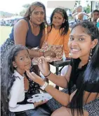  ?? Independen­t Newspapers ?? DENISE Naicker with her daughters, Tashmika, 4, and Jazaaria, 7, had the kids’ faces painted by Kiara Mudray at the Illovo 2024 reunion at the Illovo Sportsgrou­nd.