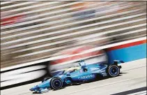  ?? Chris Graythen / Getty Images ?? Jimmie Johnson drives during the NTT IndyCar Series XPEL 375 at Texas Motor Speedway on March 20.