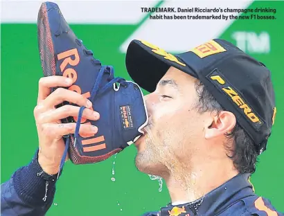  ??  ?? TRADEMARK. Daniel Ricciardo’s champagne drinking habit has been trademarke­d by the new F1 bosses.