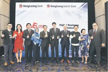  ??  ?? Fuda (fifth right) and Teoh (fourth right) pose for a photo with other Hong Leong Bank directors and founders of Biztory, Kakitangan, SimpleTax and Digital Advert yesterday.