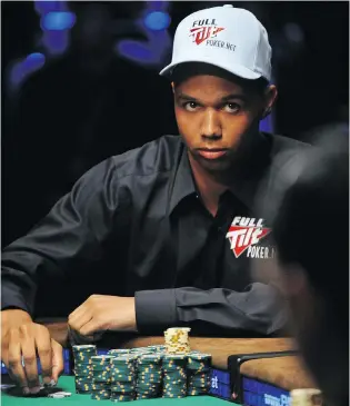  ?? ROBYN BECK / AFP / GETTY IMAGES ?? Phil Ivey plays a hand at the 2009 World Series of Poker in Las Vegas. The poker champion has lost at the British Supreme Court, which ruled he was cheating when he asked dealers to rotate cards.