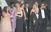  ?? Chris Pizzello, Invision ?? Lorne Michaels and the cast and crew from “Saturday Night Live” accept the award for outstandin­g variety sketch series at the Emmy Awards on Monday.