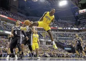  ?? AP PHOTO/MICHAEL CONROY, FILE ?? In this March 31, 2014, file photo, Indiana Pacers guard Lance Stephenson (1) reacts after a slam dunk over San Antonio Spurs guard Danny Green (4) and forward Tim Duncan (21) during the first half of an NBA basketball game in Indianapol­is.