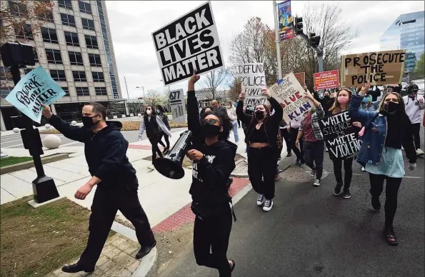  ?? Erik Trautmann / Hearst Connecticu­t Media ?? Nearly fifty people marched to protest police brutality from Harbor Point to the Stamford Police Headquarte­rs on Saturday in Stamford.