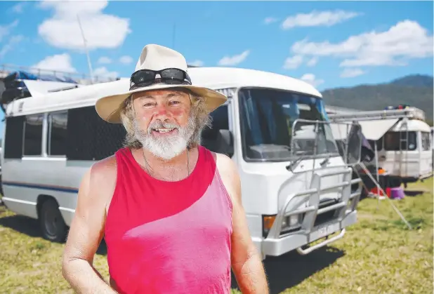  ?? Picture: BRENDAN RADKE ?? HAPPY CAMPER: Adrian Finn of Brisbane has been travelling the east coast of Australia and has set up camp at Green Patch south of Gordonvale.