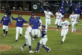  ?? TONY GUTIERREZ - ASSOCIATED PRESS FILE ?? The Los Angeles Dodgers celebrate after defeating the Tampa Bay Rays 3-1 in in Game 6 to win baseball’s World Series in Arlington, Texas on Oct. 27.